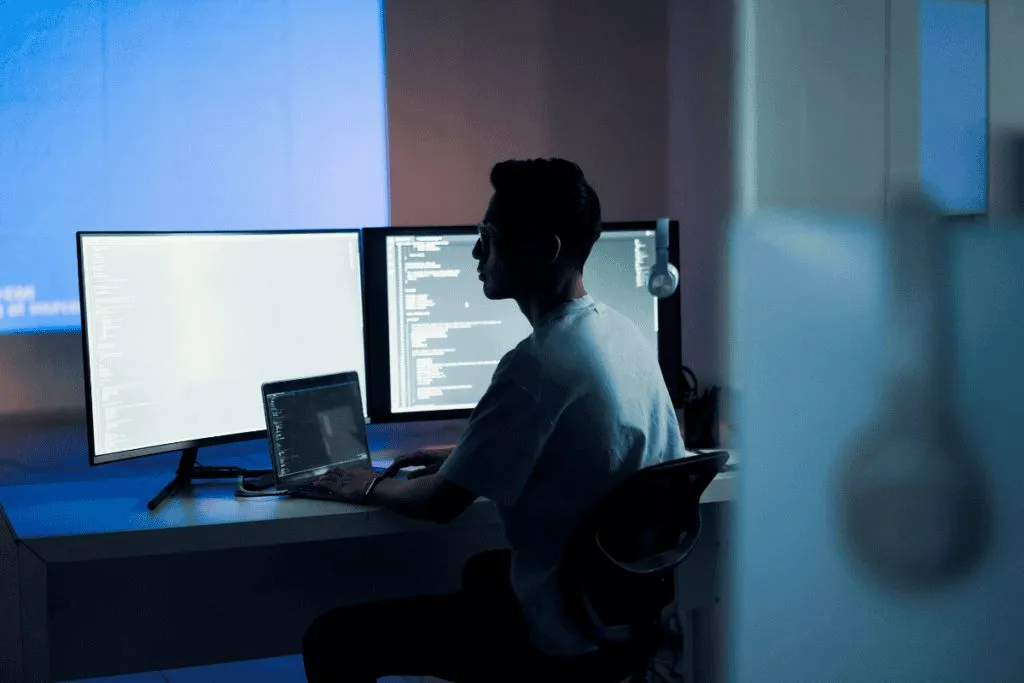 A person reviewing browser privacy and site permission settings on a laptop